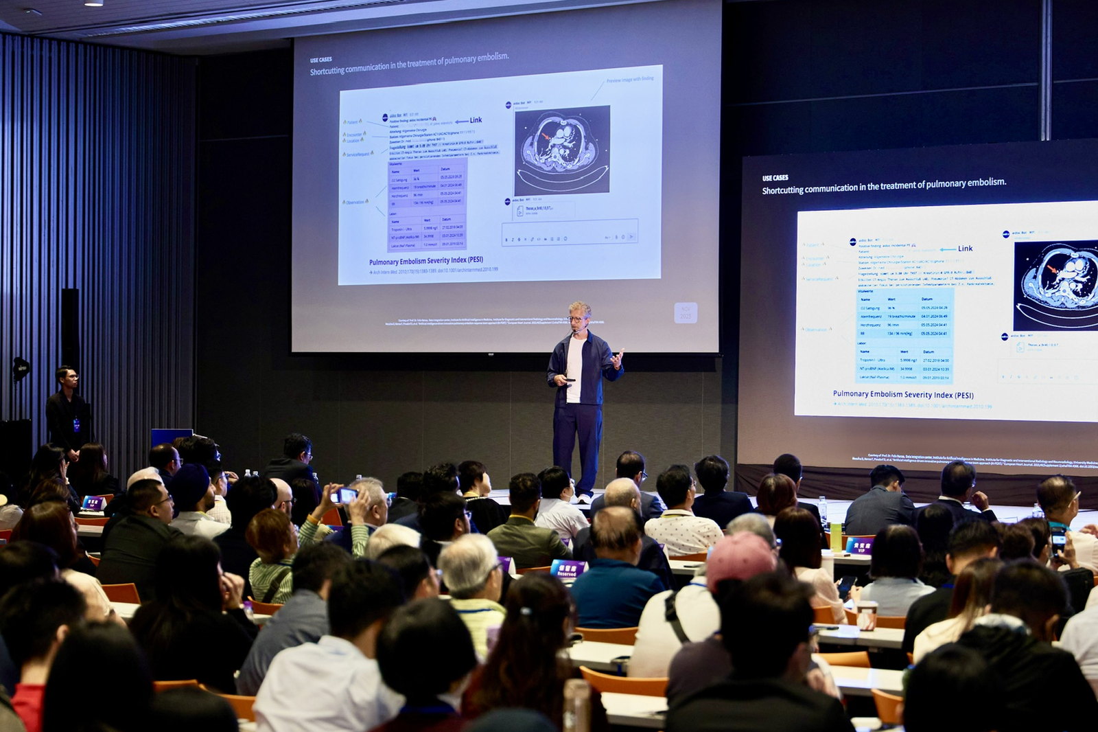 Jan Beger presenting a pulmonary embolism use case to a full auditorium in Taiwan